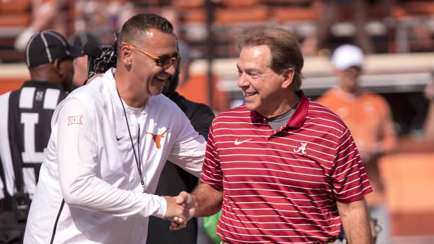 Steve Sarkisian and Nick Saban shake hands